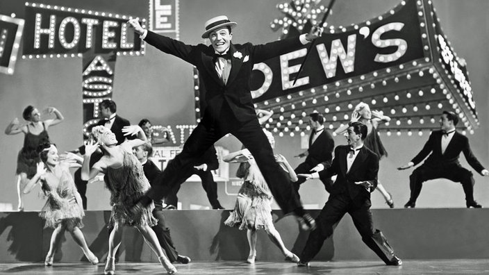 Tanzszene mit Gene Kelly aus "Singin' In The Rain"