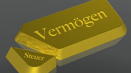 Ein Goldbarren mit den Worten "Vermögenssteuer"