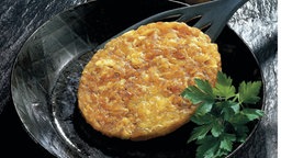 Ein Rösti in der Pfanne