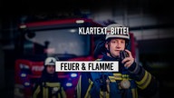 Feuerwehrmann mit Handfunke