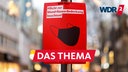 Während der Corona-Pandemie weist ein Schild in der Kölner Innenstadt weist auf die Maskenpflicht hin