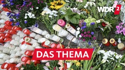 Messerattacke Solingen: Blumen und Kerzen, die in der Nähe des Tatorts niedergelegt wurden  