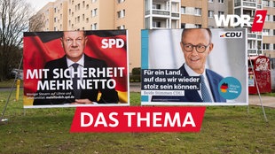 Wahlplakate von SPD und CDU für die Bundestagswahl 2025 vor einem Wohnblock