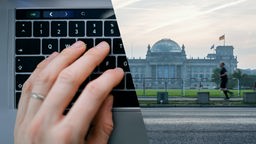Montage: Hand auf Tastatur. Reichstagsgebäude in Berlin