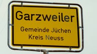 Ortsschild "Garzweiler" am Ortseingang
