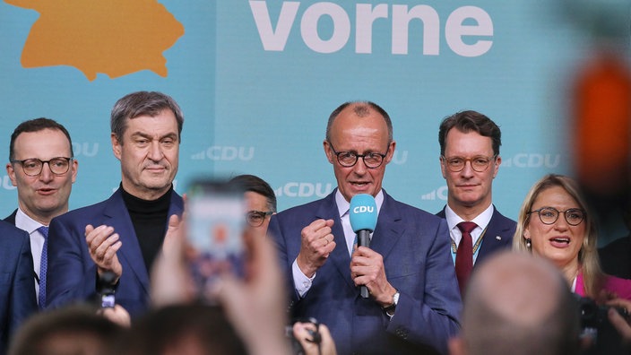 Friedrich Merz (Mitte) und Jens Spahn, Markus Soeder, Boris Rhein, Hendrik Wuest, Christina Stumpp