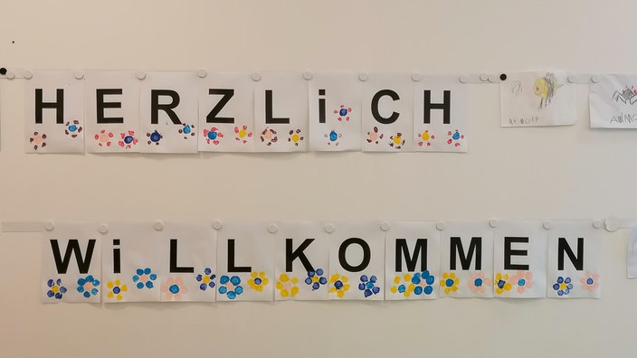 Schriftzug Herzlich Willkommen