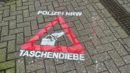 Mit Graffiti gegen Taschendiebstahl