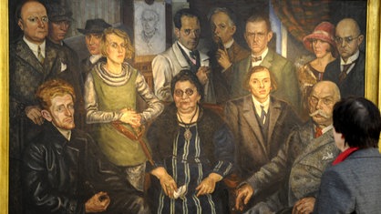 Das Bild "Die Zeitgenossen" von Arthur Kaufmann mit "Mutter" Johanna Ey und Mitgliedern der Künstlergruppe "Das junge Rheinland".