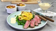 Kartoffelrose auf Bohnennest zu Lammrückensteaks